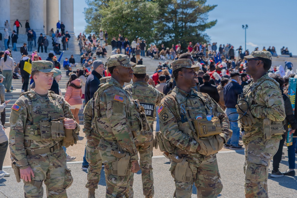 Soldiers from the Mississippi National Guard patrol during the Cherry Blossom Festival