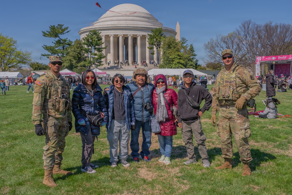 Soldiers from the Mississippi National Guard patrol during the Cherry Blossom Festival