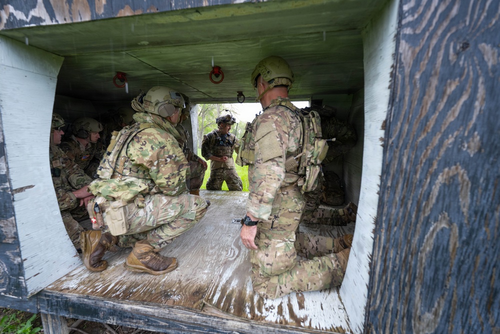 Airmen from the 113th Contingency Response Squadron and 181st Medical Group participate in Round-robin helicopter training on a UH-60 Black Hawk at Camp Atterbury