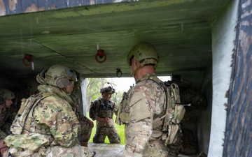 Airmen from the 113th Contingency Response Squadron and 181st Medical Group participate in Round-robin helicopter training on a UH-60 Black Hawk at Camp Atterbury