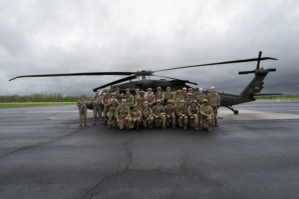 Airmen from the 113th Contingency Response Squadron and 181st Medical Group participate in Round-robin helicopter training on a UH-60 Black Hawk at Camp Atterbury