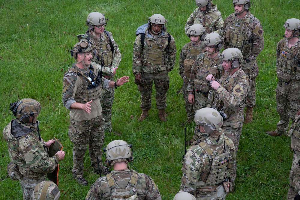Airmen from the 113th Contingency Response Squadron and 181st Medical Group participate in Round-robin helicopter training on a UH-60 Black Hawk at Camp Atterbury