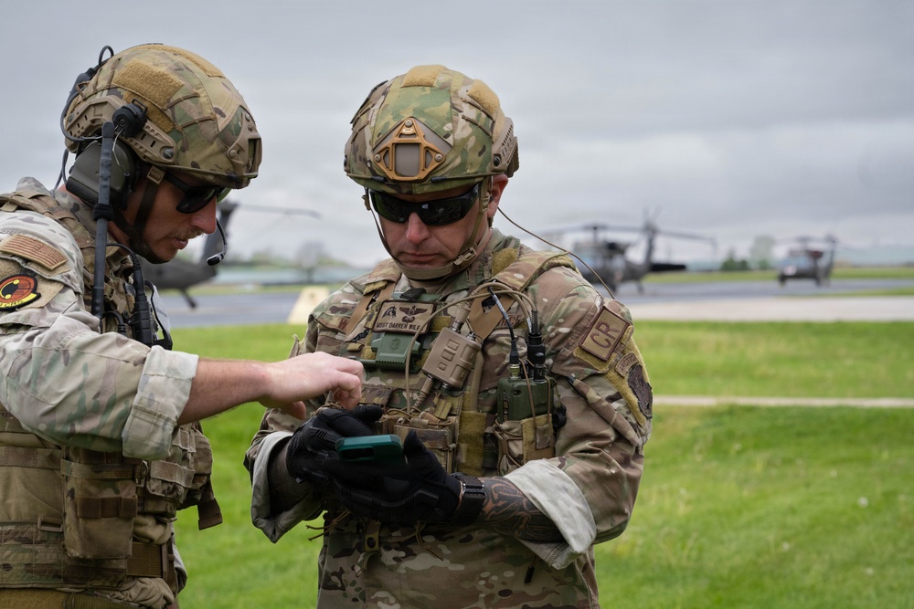 Airmen from the 113th Contingency Response Squadron and 181st Medical Group participate in Round-robin helicopter training on a UH-60 Black Hawk at Camp Atterbury