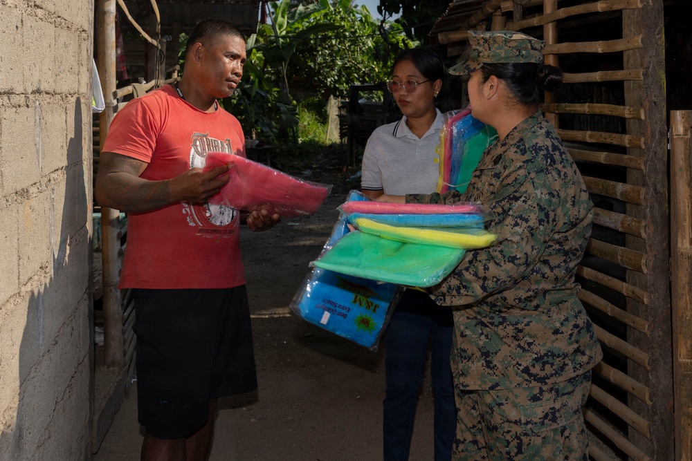 Balikatan 2026: U.S. service members hand out mosquito nets as part of a cooperative health engagement in Casiguran