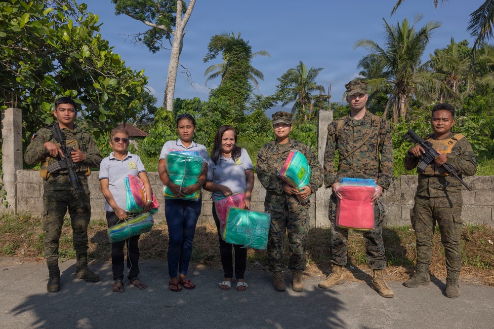 Balikatan 2026: U.S. service members hand out mosquito nets as part of a cooperative health engagement in Casiguran