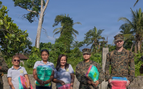 Balikatan 2026: U.S. service members hand out mosquito nets as part of a cooperative health engagement in Casiguran