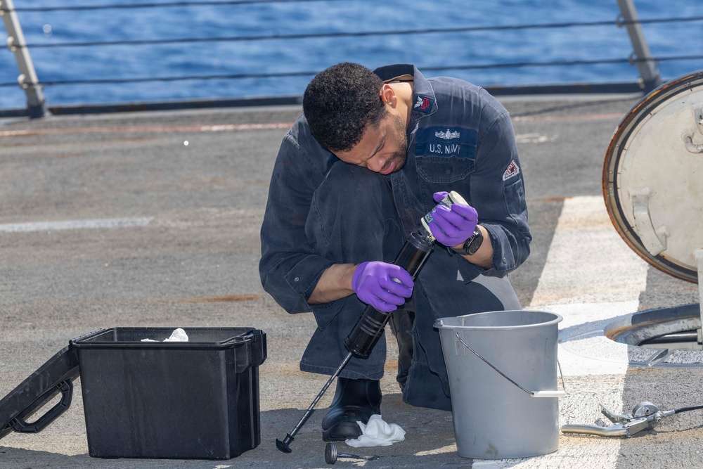 Gunner's Mate performs maintenance on USS Bulkeley (DDG 84), April 10, 2026