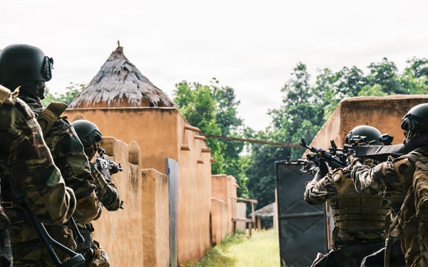 Green Berets and Cameroonian special operations soldiers execute urban maneuvers during Flintlock 26