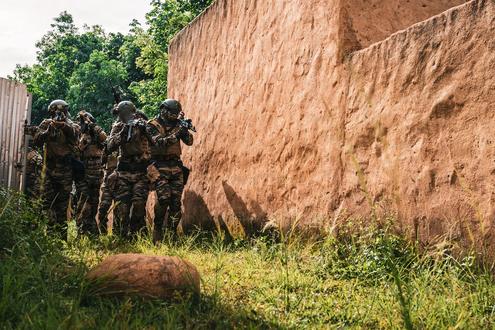 Green Berets and Cameroonian special operations soldiers execute urban maneuvers during Flintlock 26