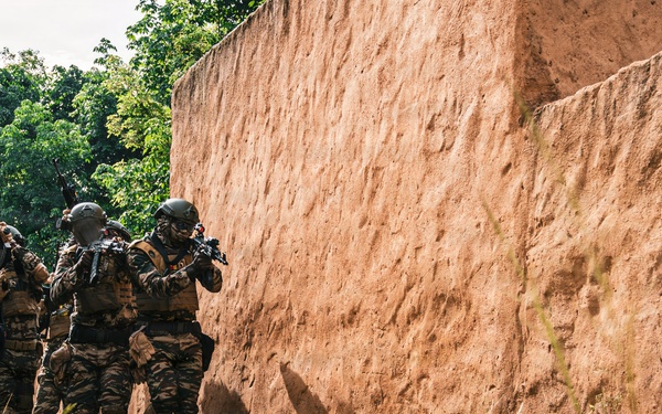 Green Berets and Cameroonian special operations soldiers execute urban maneuvers during Flintlock 26