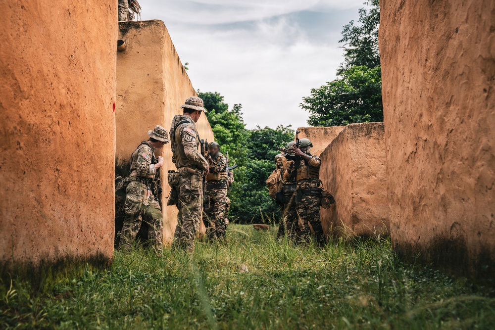 Green Berets and Cameroonian special operations soldiers execute urban maneuvers during Flintlock 26
