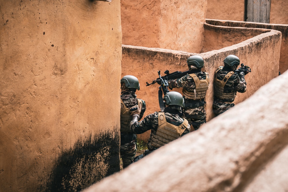 Green Berets and Cameroonian special operations soldiers execute urban maneuvers during Flintlock 26