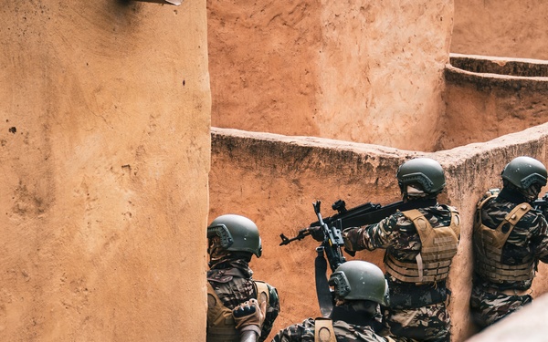Green Berets and Cameroonian special operations soldiers execute urban maneuvers during Flintlock 26