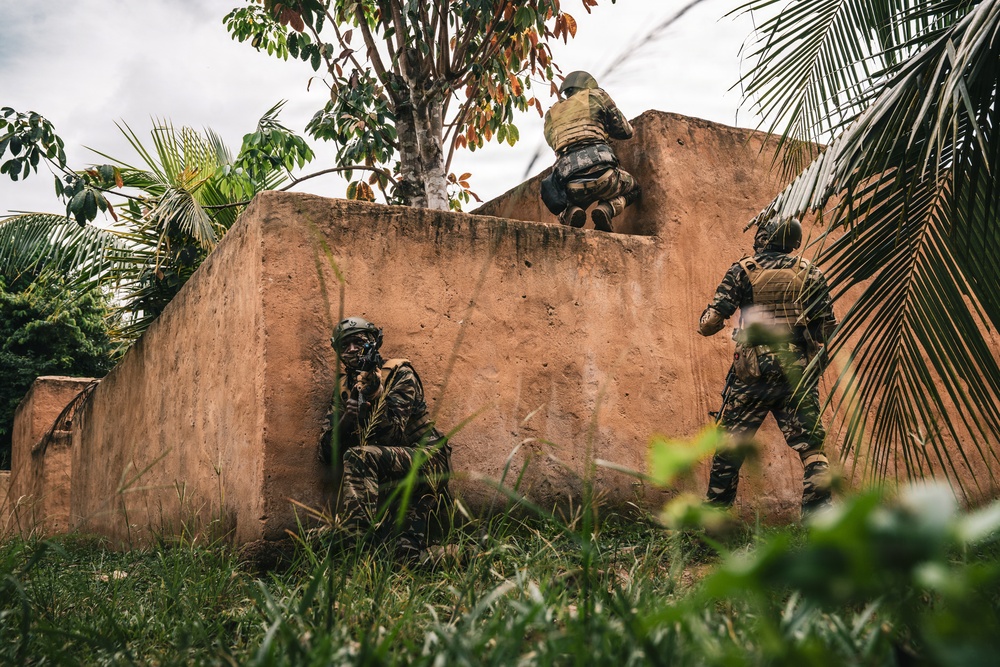 Green Berets and Cameroonian special operations soldiers execute urban maneuvers during Flintlock 26