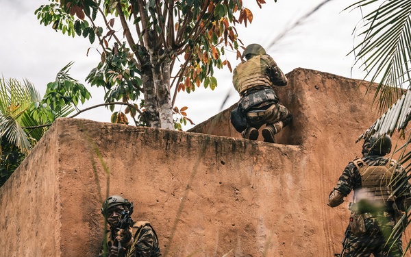 Green Berets and Cameroonian special operations soldiers execute urban maneuvers during Flintlock 26