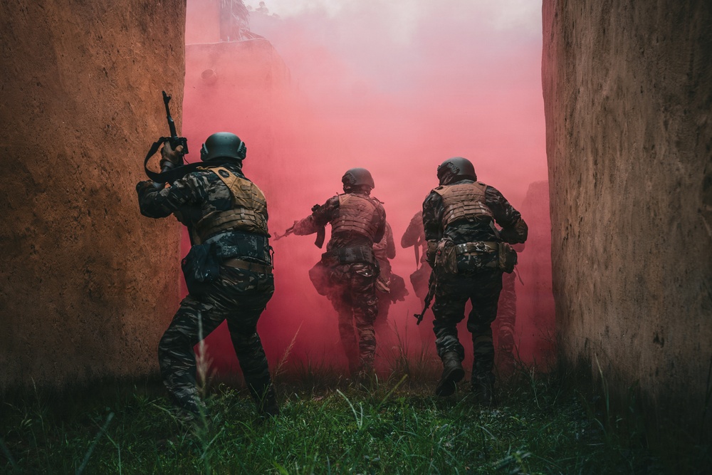 Green Berets and Cameroonian special operations soldiers execute urban maneuvers during Flintlock 26