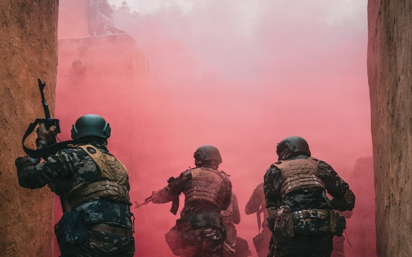 Green Berets and Cameroonian special operations soldiers execute urban maneuvers during Flintlock 26