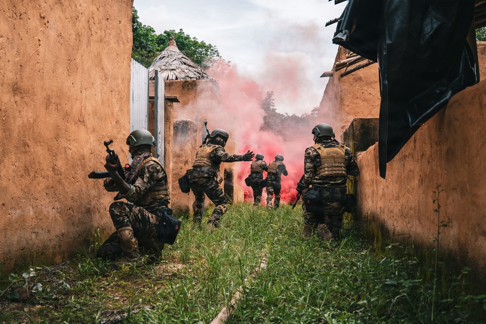 Green Berets and Cameroonian special operations soldiers execute urban maneuvers during Flintlock 26