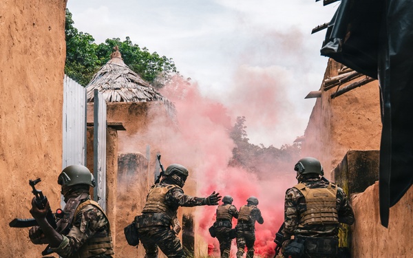 Green Berets and Cameroonian special operations soldiers execute urban maneuvers during Flintlock 26