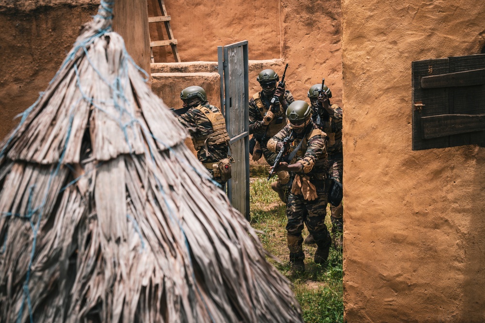 Green Berets and Cameroonian special operations soldiers execute urban maneuvers during Flintlock 26