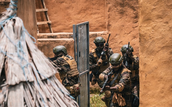 Green Berets and Cameroonian special operations soldiers execute urban maneuvers during Flintlock 26