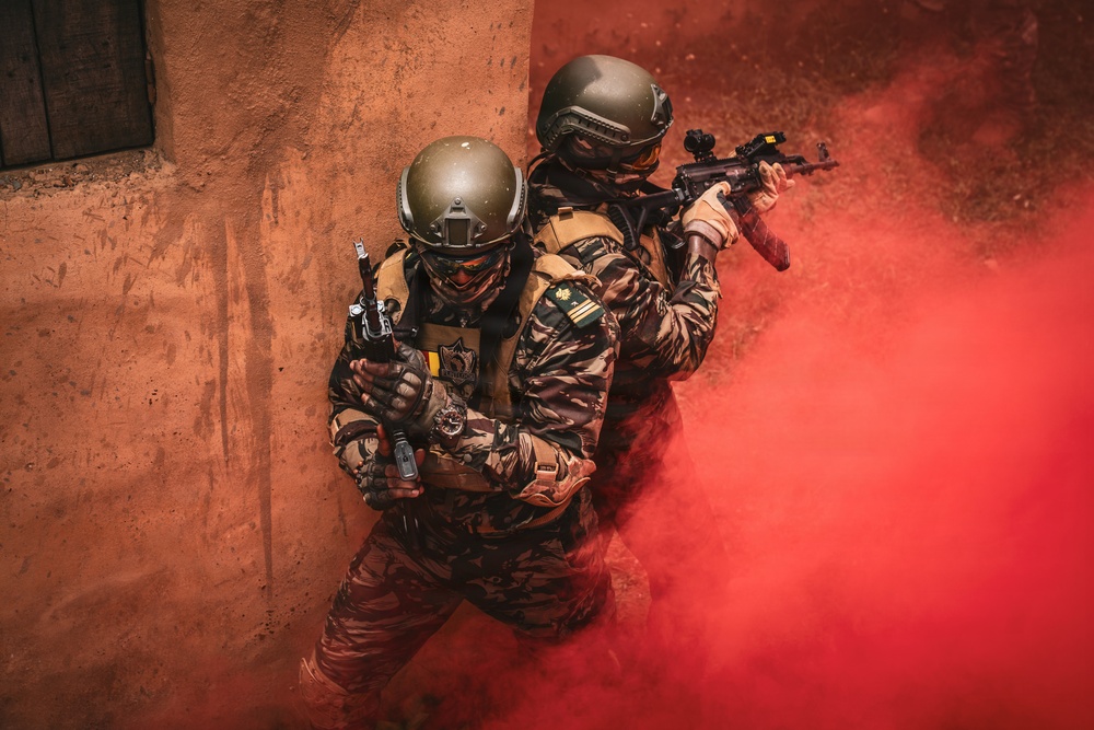 Green Berets and Cameroonian special operations soldiers execute urban maneuvers during Flintlock 26