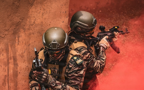 Green Berets and Cameroonian special operations soldiers execute urban maneuvers during Flintlock 26