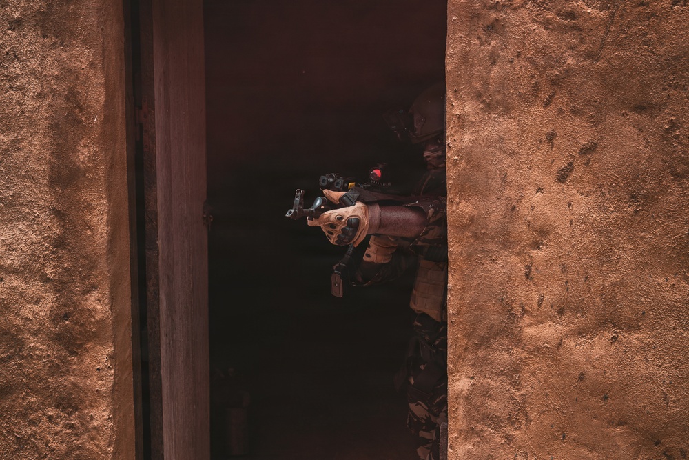 Green Berets and Cameroonian special operations soldiers execute urban maneuvers during Flintlock 26