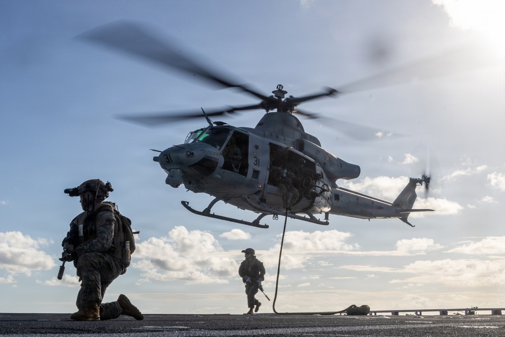 22nd MEU(SOC) | Marines and U.S. Coast Guard Fast Rope Aboard USS Fort Lauderdale