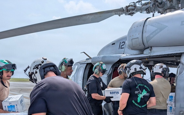 Helicopter Sea Combat Squadron (HSC) 25 Sailors Respond To Super Typhoon Sinlaku