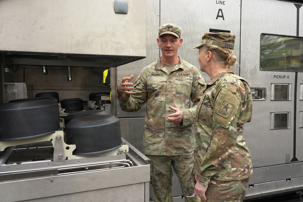 Soldier explains kitchen capabilities during leader visit
