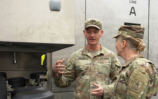 Soldier explains kitchen capabilities during leader visit