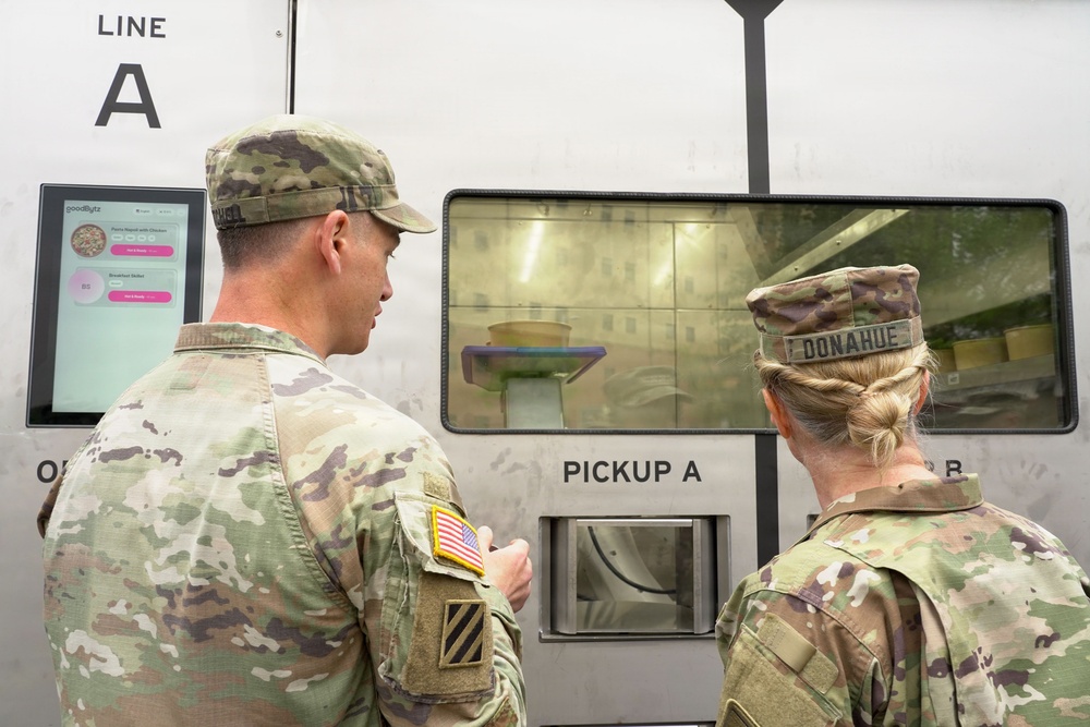 Senior leader samples meal prepared by autonomous kitchen
