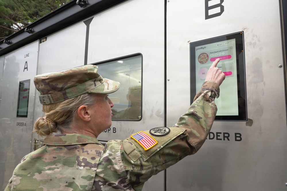 Senior leader interacts with autonomous kitchen interface