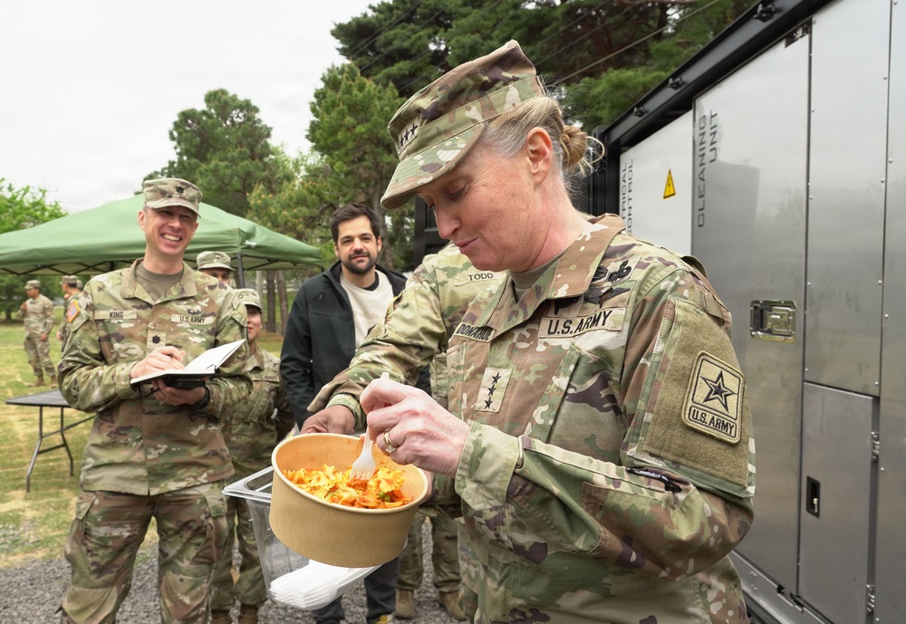 Senior leader samples meal prepared by autonomous kitchen
