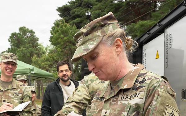 Senior leader samples meal prepared by autonomous kitchen