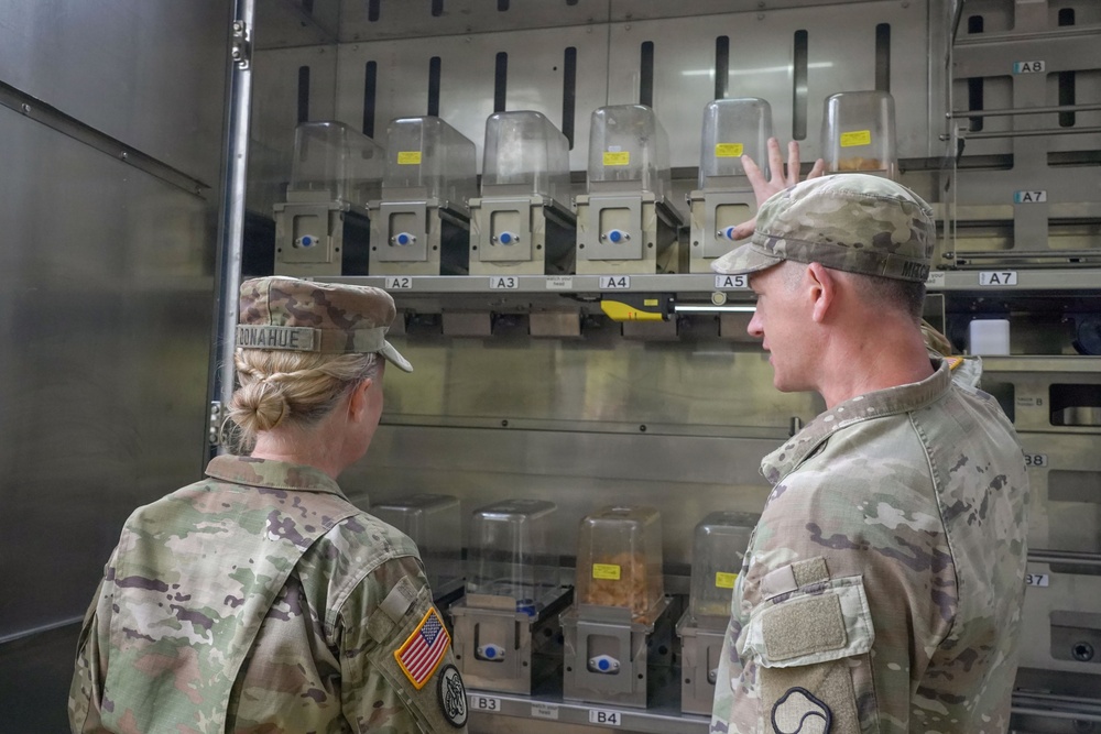 Autonomous kitchen interior highlights automated cooking process