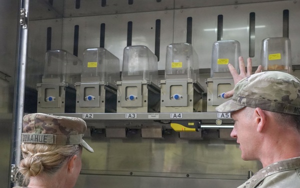 Autonomous kitchen interior highlights automated cooking process