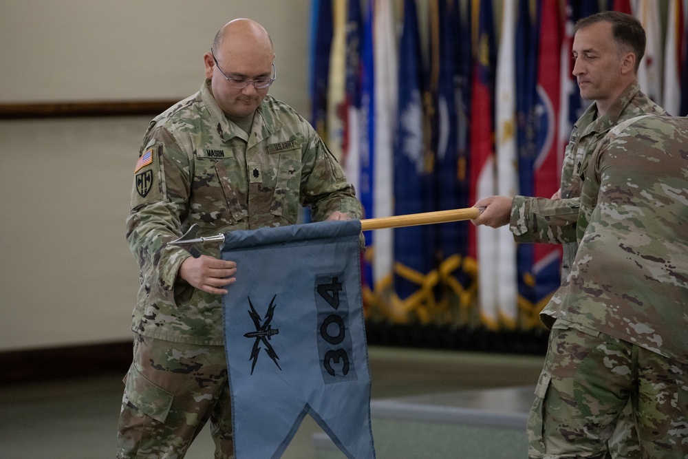 Lt. Col. Jeremy Mason uncases the colors for the newly established 304th Cyber Battalion, Army Reserve Cyber Protection Brigade at Camp Parks, Calif., on April 11, 2026.