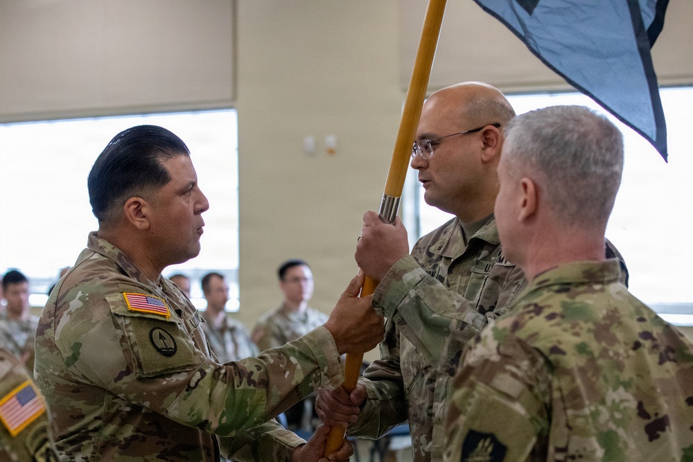 Sgt. Maj. Hector Valdez passes the 304th Cyber Battalion's colors to Lt. Col. Jeremy Mason during the battalion's Change of Command Ceremony at Camp Parks, Calif., on April 11, 2026.