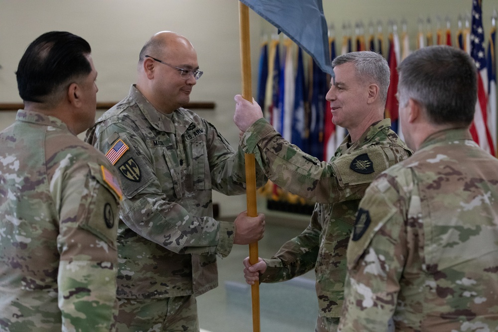 Lt. Col. Jeremy Mason passes the 304th Cyber Battalion's colors to Col. Andrew Walsh during the battalion's Change of Command Ceremony at Camp Parks, Calif., on April 11, 2026.