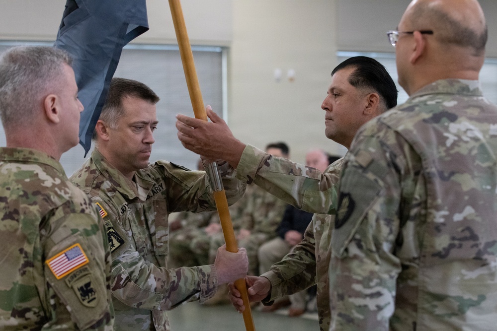 Lt. Col. Joel Joyce passes the 304th Cyber Battalion's colors to Sgt. Maj. Hector Valdez during the battalion's Change of Command Ceremony at Camp Parks, Calif., on April 11, 2026.