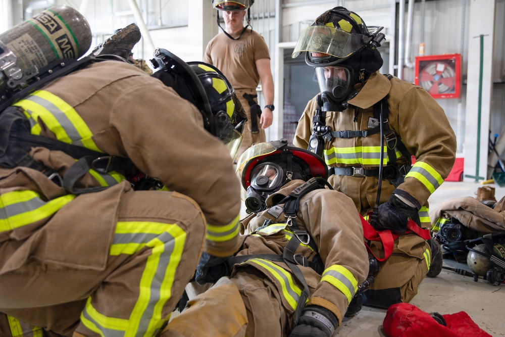 U.S. Army Firefighters conduct downed firefighter rescue training
