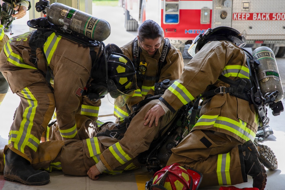 U.S. Army Firefighters conduct downed firefighter rescue training