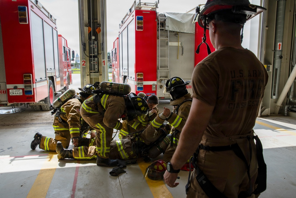 U.S. Army Firefighters conduct downed firefighter rescue training