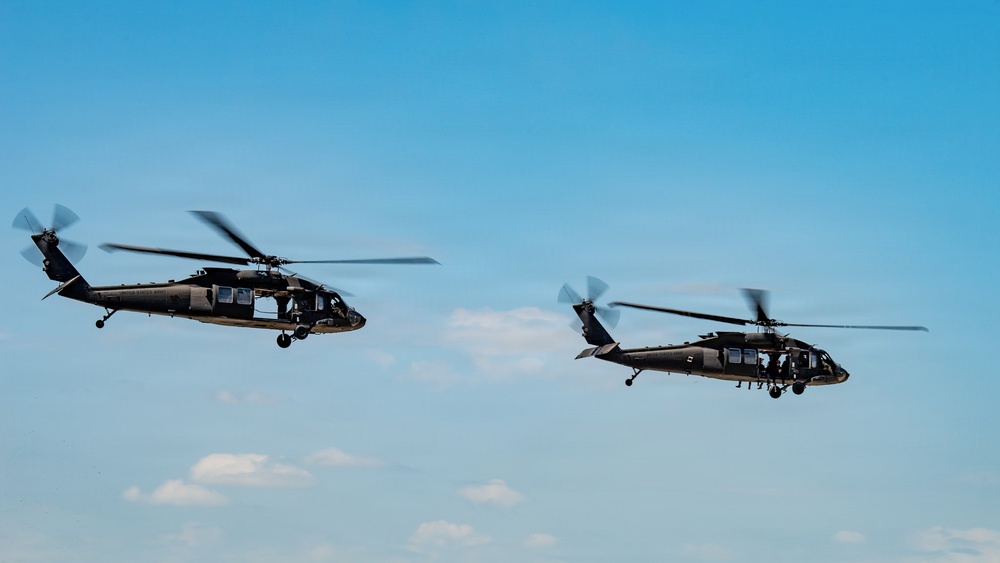 Military aircraft practice at Kentucky Air Guard Base for Thunder Over Louisville air show