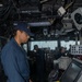 USS Iwo Jima Sailor Steers the Ship