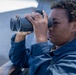 U.S Sailors stand a bridge aboard USS Delbert D. Black (DDG 119)