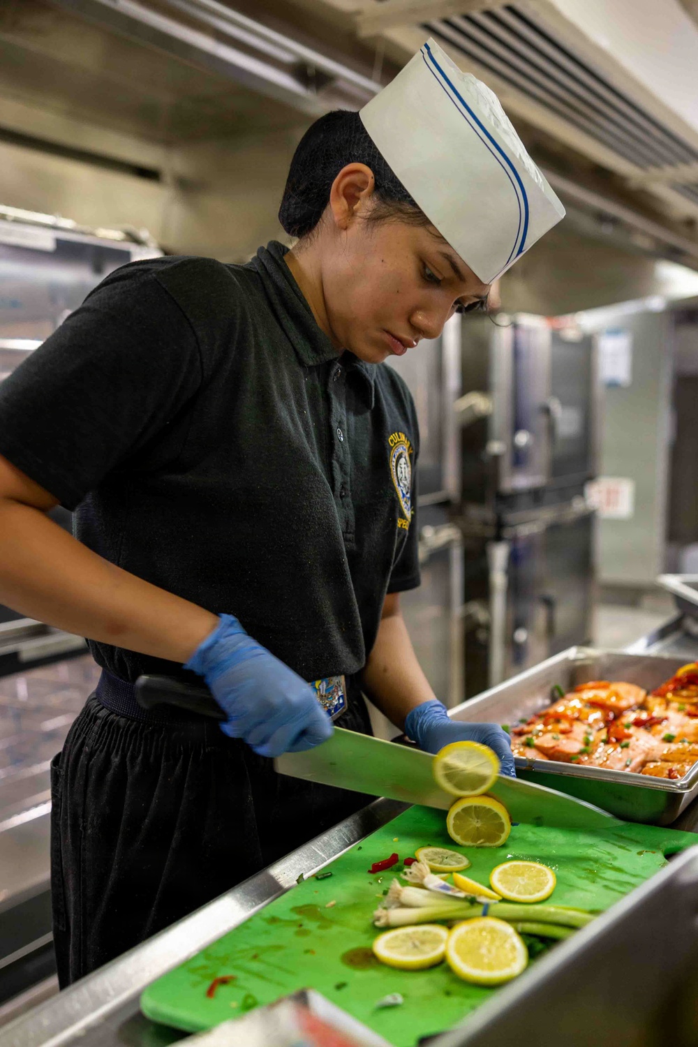 PCU John F. Kennedy Sailor Prepares Lunch