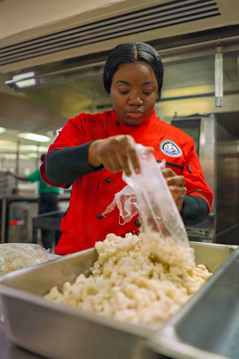 PCU John F. Kennedy Sailor Prepares Lunch